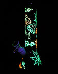 420 Leaf & Shroom Glow-in-the-Dark Water Pipe glowing in the dark