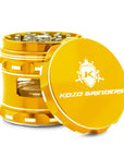 Gold herb grinder with 'Kozo Grinders' branding on a white background
