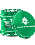 Green herb grinder with 'Kozo Grinders' logo on a white background