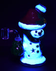 Snowman glass dab rig with UV reactive accents glowing under UV light
