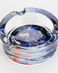Cartoon-design glass ashtray on a white background