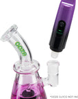 Galaxy Purple Ooze Booster Extract Vaporizer attached to a glass bong for use