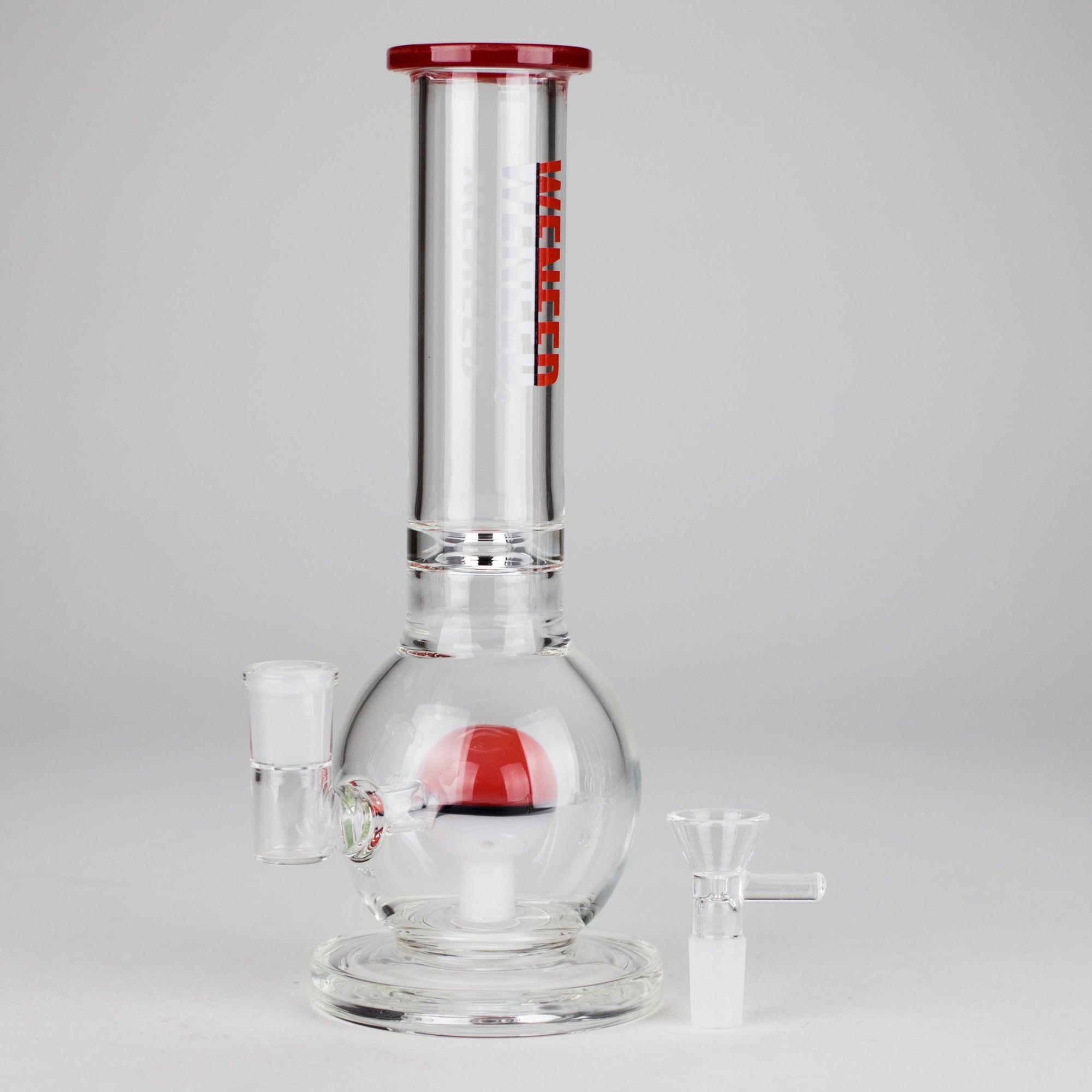 Clear Glass Bubble Bong with red Pocket Orb Perc on a gray background