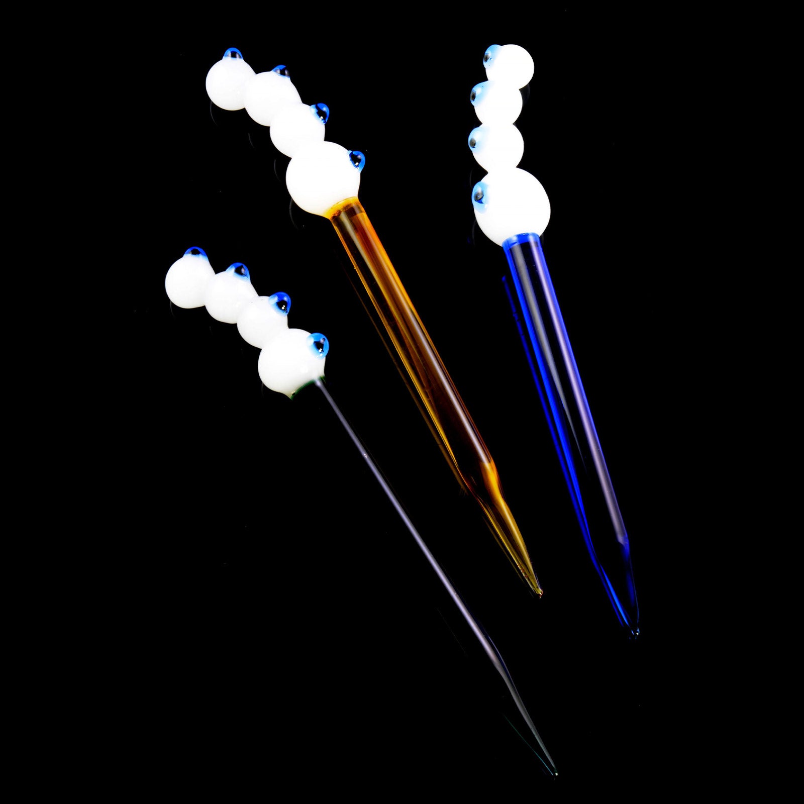 Four-Eyes Glass Dab Tools for Wax on black background