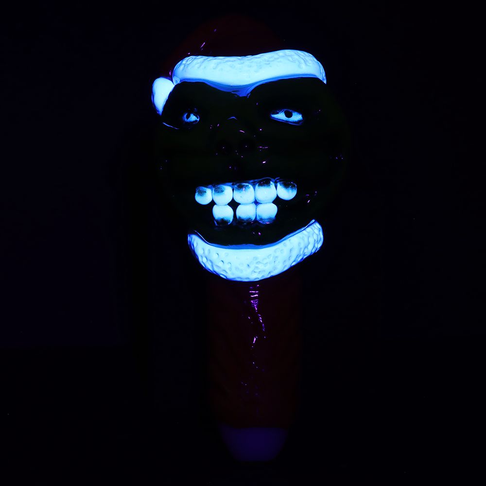 Grinch Spoon Pipe glowing under blacklight