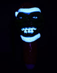 Grinch Spoon Pipe glowing under blacklight