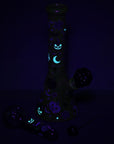 Halloween Party Bong Glow Duo glowing in the dark, showcasing spooky glow-in-the-dark accents on bong and hand pipe
