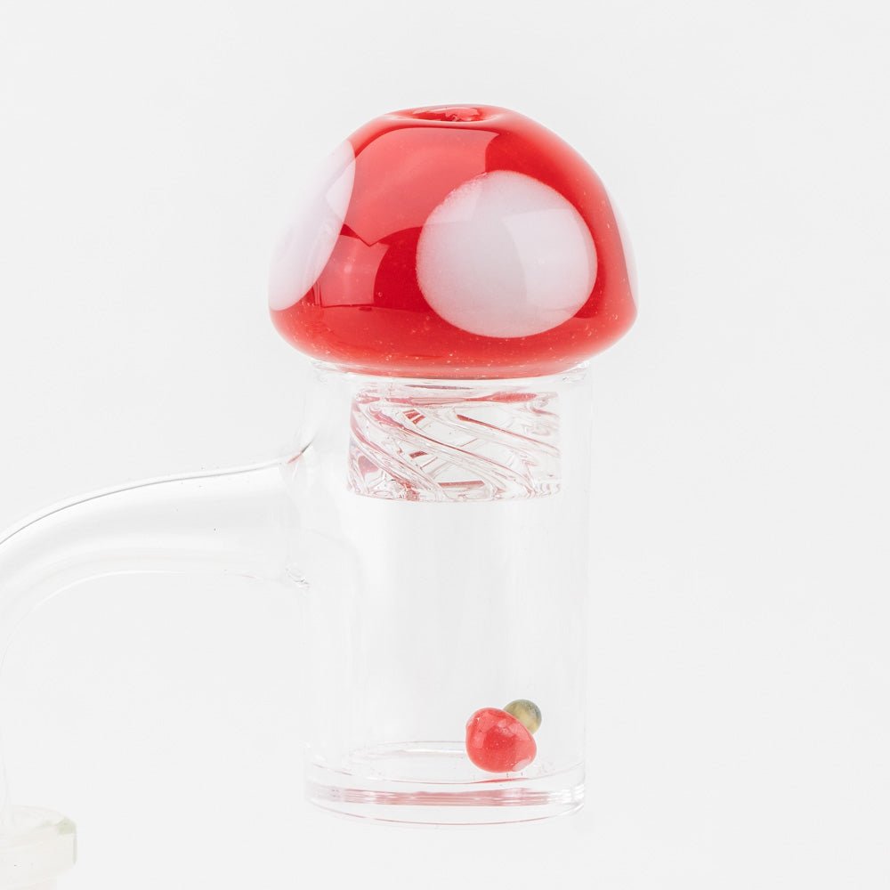 Mushroom Spinner Cap placed on quartz banger with Terp Pearl