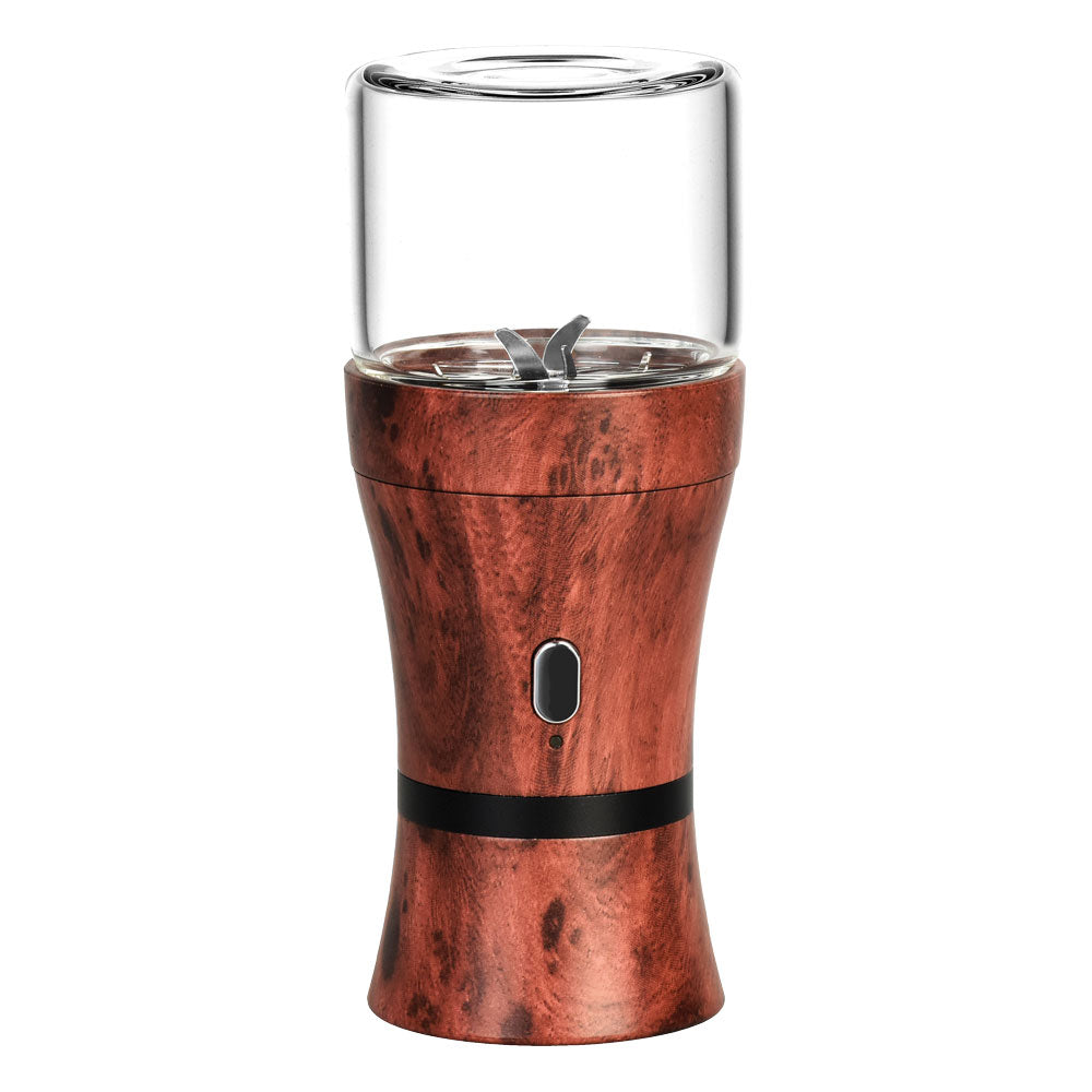 Pulsar King Kut Portable Electric Herb Grinder placed on a wooden surface