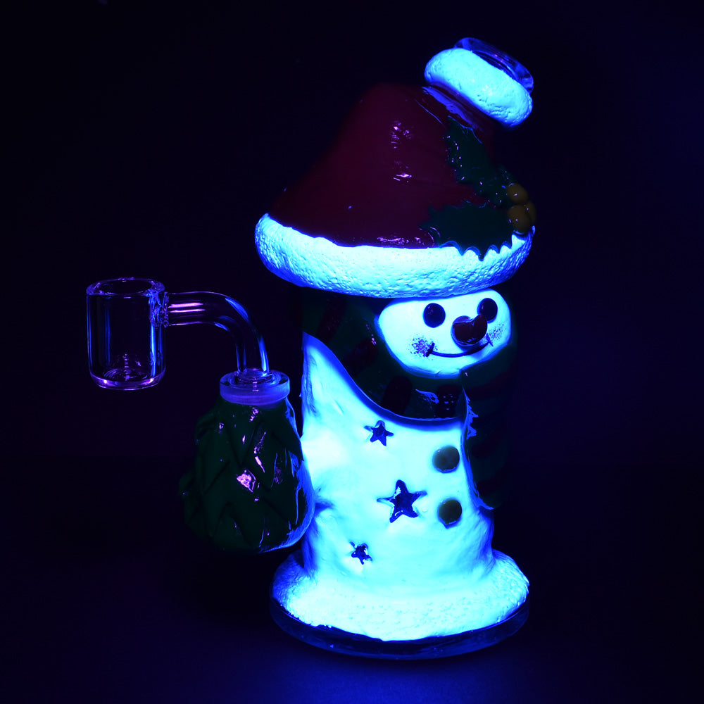 Snowman glass dab rig with UV reactive accents glowing under UV light